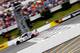 LONG POND, PA - AUGUST 03: Dale Earnhardt Jr., driver of the #88 Michael Baker International Chevrolet, crosses the finish line to win the NASCAR Sprint Cup Series GoBowling.com 400 at Pocono Raceway on August 3, 2014 in Long Pond, Pennsylvania. (Photo