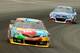 LONG POND, PA - AUGUST 03: Kyle Busch, driver of the #18 M&M's Toyota, leads Kasey Kahne, driver of the #5 Farmers Insurance Chevrolet, during the NASCAR Sprint Cup Series GoBowling.com 400 at Pocono Raceway on August 3, 2014 in Long Pond, Pennsylvania.