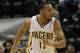 Mar 17, 2014; Indianapolis, IN, USA; Indiana Pacers forward Evan Turner (12) runs up court during the second quarter against the Philadelphia 76ers at Bankers Life Fieldhouse. The Pacers won 99-90. Mandatory Credit: Pat Lovell-USA TODAY Sports