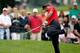 AKRON, OH - AUGUST 03: Tiger Woods hits out of the rough on the second hole during the final round of the World Golf Championships-Bridgestone Invitational at Firestone Country Club South Course on August 3, 2014 in Akron, Ohio. (Photo by Gregory Shamus