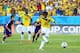 CUIABA, BRAZIL - JUNE 24: Juan Guillermo Cuadrado of Colombia shoots and scores his team's first goal on a penalty kick during the 2014 FIFA World Cup Brazil Group C match between Japan and Colombia at Arena Pantanal on June 24, 2014 in Cuiaba, Brazil.