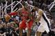 SAN ANTONIO, TX - MAY 14: LaMarcus Aldridge #12 of the Portland Trail Blazers attempts to drive around Tim Duncan #21 of the San Antonio Spurs in Game Five of the Western Conference Semifinals during the 2014 NBA Playoffs at the AT&T Center on May 14, 20