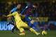 VILLARREAL, SPAIN - JANUARY 28: Mateo Musacchio (L) of Villarreal competes for the ball with Lionel Messi of Barcelona during the la Liga match between Villarreal and Barcelona at El Madrigal on January 28, 2012 in Villarreal, Spain. (Photo by Manuel Qu
