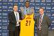 Jun 27, 2014; Independence, OH, USA; Cleveland Cavaliers first round pick Andrew Wiggins (21) is introduced by head coach David Blatt (left) and general manager David Griffin at Cleveland Clinic Courts. Mandatory Credit: David Richard-USA TODAY Sports