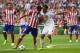 LISBON, PORTUGAL - MAY 24: Diego Costa of Club Atletico de Madrid holds off Sami Khedira of Real Madrid during the UEFA Champions League Final between Real Madrid and Atletico de Madrid at Estadio da Luz on May 24, 2014 in Lisbon, Portugal. (Photo by Sh
