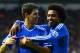 DERBY, ENGLAND - JANUARY 05: Willian of Chelsea (R) congratulates Oscar of Chelsea on scoring their second goal during the Budweiser FA Cup Third Round match between Derby County and Chelsea at iPro Stadium on January 5, 2014 in Derby, England. (Photo b