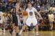 OAKLAND, CA - MARCH 22: Klay Thompson #11 of the Golden State Warriors defends Tony Parker #9 of the San Antonio Spurs on March 22, 2014 at Oracle Arena in Oakland, California. NOTE TO USER: User expressly acknowledges and agrees that, by downloading and