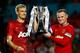 MIAMI GARDENS, FL - AUGUST 04: (L) Darren Fletcher #24 of Manchester United and (R) Wayne Rooney #10 of Manchester United lift the winners trophy following their 3-1 victory over Liverpool in the Guinness International Champions Cup 2014 Final at Sun Li
