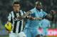 TURIN, ITALY - JANUARY 22: Mauricio Isla (L) of Juventus FC competes with Michael Ciani of S.S. Lazio during the TIM cup match between Juventus FC and S.S. Lazio at Juventus Arena on January 22, 2013 in Turin, Italy. (Photo by Valerio Pennicino/Getty Im