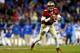 CHARLOTTE, NC - DECEMBER 07: Quarterback Jameis Winston #5 of the Florida State Seminoles looks to pass against the Duke Blue Devils during the ACC Championship game at Bank of America Stadium on December 7, 2013 in Charlotte, North Carolina. (Photo by