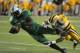 October 20, 2012; Hattiesburg, MS, USA; Marshall Thundering Herd wide receiver Tommy Shuler (1) dives for the end zone while being hit by Southern Miss Golden Eagles defensive back Emmanuel Johnson (12) during their game at M.M. Roberts Stadium. Mandatory