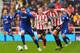SUNDERLAND, ENGLAND - APRIL 27: Jordon Mutch of Cardiff City is closed down by Santiago Vergini of Sunderland during the Barclays Premier League match between Sunderland and Cardiff City at the Stadium of Light on April 27, 2014 in Sunderland, England. (