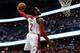 WASHINGTON, DC - APRIL 25: John Wall #4 of the Washington Wizards drives to the basket for a dunk in first quarter action of Game 3 of the Eastern Conference Quarterfinals against the Chicago Bulls during the 2014 NBA Playoffs at the Verizon Center on Ap