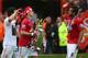 MANCHESTER, ENGLAND - MAY 12: Javier Hernandez of Manchester United celebrates with the trophy and team-mates Anderson (r) and Rafael (l) following the Barclays Premier League match between Manchester United and Swansea City at Old Trafford on May 12, 20