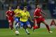 Li chases Juninho at the 2002 World Cup