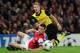 LONDON, ENGLAND - OCTOBER 22: Marco Reus of Borussia Dortmund and Laurent Koscielny of Arsenal in action during the UEFA Champions League Group F match between Arsenal and Borussia Dortmund at Emirates Stadium on October 22, 2013 in London, England. (Ph