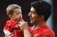 LIVERPOOL, ENGLAND - MAY 11: Luis Suarez of Liverpool with his son Benjamin after the Barclays Premier League match between Liverpool and Newcastle United at Anfield on May 11, 2014 in Liverpool, England. Liverpool finish as runners-up in the Premier Lea