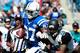 JACKSONVILLE, FL - SEPTEMBER 29: Josh Evans #26 of the Jacksonville Jaguars attempts to tackle Reggie Wayne #87 of the Indianapolis Colts during the game at EverBank Field on September 29, 2013 in Jacksonville, Florida. (Photo by Sam Greenwood/Getty Im