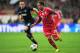 MUNICH, GERMANY - APRIL 09: Mario Goetze of Bayern Muenchen goes past Phil Jones of Manchester United during the UEFA Champions League Quarter Final second leg match between FC Bayern Muenchen and Manchester United at Allianz Arena on April 9, 2014 in Mu