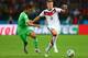 PORTO ALEGRE, BRAZIL - JUNE 30: Toni Kroos of Germany and Saphir Taider of Algeria compete for the ball during the 2014 FIFA World Cup Brazil Round of 16 match between Germany and Algeria at Estadio Beira-Rio on June 30, 2014 in Porto Alegre, Brazil. (P