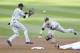 Alexei Ramirez and Gordon Beckham turn a double play.