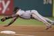PHILADELPHIA, PA - JULY 23: Third baseman Pablo Sandoval #48 of the San Francisco Giants makes a diving stop but was unable to throw out center fielder Ben Revere #2 of the Philadelphia Phillies in the bottom of the first inning on July 23, 2014 at Citize