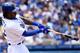 LOS ANGELES, CA - AUGUST 03: Hanley Ramirez #13 of the Los Angeles Dodgers breaks his bat as he drives in a run in the first inning against the Chicago Cubs at Dodger Stadium on August 3, 2014 in Los Angeles, California. (Photo by Lisa Blumenfeld/Getty