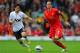 LIVERPOOL, ENGLAND - SEPTEMBER 23: Daniel Agger of Liverpool in action with Shinji Kagawa of Manchester United during the Barclays Premier League match between Liverpool and Manchester United at Anfield on September 23, 2012 in Liverpool, England. (Photo