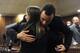 PRETORIA, SOUTH AFRICA -JULY 2: Oscar Pistorius hugs a supporter in the Pretoria High Court on July 2, 2014, in Pretoria, South Africa. Oscar Pistorius stands accused of the murder of his girlfriend, Reeva Steenkamp, on February 14, 2013. This is Pistoriu