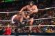 Rusev attacks Big E from the ring apron.
