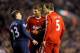 LIVERPOOL, ENGLAND - DECEMBER 13: Daniel Agger and Steven Gerrard of Liverpool have words with Andrey Arshavin of Arsenal during the Barclays Premier League match between Liverpool and Arsenal at Anfield on December 13, 2009 in Liverpool, England. (Phot