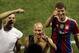 Bayern Munich players Manuel Neuer, left, Arjen Robben, center, and Thomas Muller acknowledge the fans following the MLS All-Star Game.