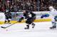 LOS ANGELES, CA - JANUARY 13: Tyler Toffoli #73 of the Los Angeles Kings skates with the puck against Zack Kassian #9 of the Vancouver Canucks at Staples Center on January 13, 2014 in Los Angeles, California. (Photo by Noah Graham/NHLI via Getty Images)