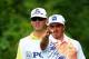 LOUISVILLE, KY - AUGUST 07: Rickie Fowler of the United States talks with caddie Joseph Skovron on the fourth tee during the first round of the 96th PGA Championship at Valhalla Golf Club on August 7, 2014 in Louisville, Kentucky. (Photo by David Cannon