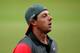 McIlroy wore his hat backward briefly while leaving the 18th green, then quickly switched it back.