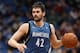 MINNEAPOLIS, MN - April 2: Kevin Love #42 of the Minnesota Timberwolves handles the ball against the Memphis Grizzlies on April 2, 2014 at Target Center in Minneapolis, Minnesota. NOTE TO USER: User expressly acknowledges and agrees that, by downloading