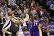 Apr 16, 2014; San Antonio, TX, USA; San Antonio Spurs guard Tony Parker (9) shoots the ball past Los Angeles Lakers forward Jordan Hill (27) during the first half at AT&T Center. Mandatory Credit: Soobum Im-USA TODAY Sports