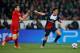 PARIS, FRANCE - MARCH 12: Edinson Cavani of Paris Saint-Germain evades Philipp Wollscheid of Bayer Leverkusen during the UEFA Champions League Round of 16 second leg match between Paris Saint-Germain FC and Bayer Leverkusen at Parc des Princes on March 1