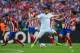 LISBON, PORTUGAL - MAY 24: Sami Khedira of Real Madrid and Tiago of Club Atletico de Madrid battle for the ball uring the UEFA Champions League Final between Real Madrid and Atletico de Madrid at Estadio da Luz on May 24, 2014 in Lisbon, Portugal. (Phot