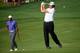 LOUISVILLE, KY - AUGUST 07: Phil Mickelson (R) of the United States hits an approach shot on the tenth hole as Tiger Woods (L) of the United States looks on during the first round of the 96th PGA Championship at Valhalla Golf Club on August 7, 2014 in Lo
