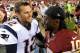 LANDOVER, MD - AUGUST 07: Quarterback Tom Brady #12 of the New England Patriots and quarterback Robert Griffin III #10 of the Washington Redskins talk following a preseason NFL game at FedExField on August 7, 2014 in Landover, Maryland. The Washington Red