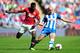 LONDON, ENGLAND - AUGUST 11: Wilfried Zaha of Manchester United and Stephen Crainey of Wigan Athletic tussle for the ball during the FA Community Shield match between Manchester United and Wigan Athletic at Wembley Stadium on August 11, 2013 in London, E
