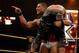 Jason Jordan lifts Enzo Amore while taunting Colin Cassady.