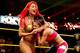 Eva Marie puts Bayley in a headlock.