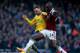 LONDON, ENGLAND - DECEMBER 26: Thomas Vermaelen of Arsenal battles with Carlton Cole of West Ham United during the Barclays Premier League match between West Ham United and Arsenal at Boleyn Ground on December 26, 2013 in London, England. (Photo by Bryn