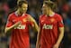 WIGAN, ENGLAND - APRIL 11: Jonny Evans of Manchester United speaks to team mate Phil Jones during the Barclays Premier League match between Wigan Athletic and Manchester United at the DW Stadium on April 11, 2012 in Wigan, England. (Photo by Michael Rega