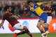 ROME, ITALY - APRIL 02: Amauri (L) of FC Parma competes for the ball with Mehdi Benatia of AS Roma during the Serie A match between AS Roma and FC Parma at Olimpico Stadium on April 2, 2014 in Rome, Italy. (Photo by Paolo Bruno/Getty Images)