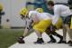 GREEN BAY, WI - MAY 16: Corey Linsley #63 of the Green Bay Packers runs through some drills during rookie minicamp at Don Hudson Center on May 16, 2014 in Green Bay, Wisconsin. (Photo by Mike McGinnis/Getty Images)