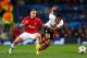 MANCHESTER, ENGLAND - DECEMBER 10: Alexander Buttner of Manchester United competes with Douglas Costa of Shakhtar Donetsk during the UEFA Champions League Group A match between Manchester United and Shakhtar Donetsk at Old Trafford on December 10, 2013 i