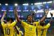 RIO DE JANEIRO, BRAZIL - JUNE 28: Juan Guillermo Cuadrado of Colombia celebrates his team's second goal scored by James Rodriguez (L) during the 2014 FIFA World Cup Brazil round of 16 match between Colombia and Uruguay at Maracana on June 28, 2014 in Rio